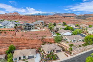Aerial view of residential area featuring a mountainous background