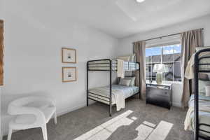 Bedroom with carpet flooring and baseboards