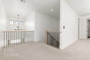 Hallway with a chandelier, carpet floors, baseboards, an upstairs landing, and recessed lighting