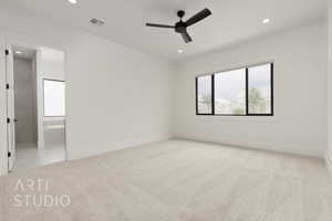 Unfurnished bedroom with light carpet, recessed lighting, baseboards, ensuite bathroom, and a ceiling fan