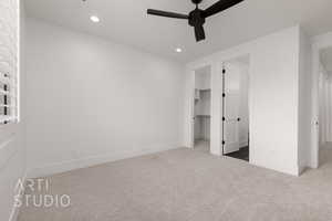 Unfurnished bedroom featuring carpet flooring, a spacious closet, recessed lighting, baseboards, and ceiling fan
