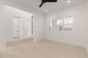 Spare room with ceiling fan, recessed lighting, baseboards, light carpet, and light wood finished floors