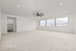 Unfurnished room featuring light carpet, recessed lighting, and a ceiling fan