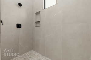 Bathroom with a tile shower