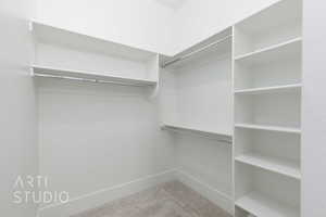 Walk in closet with carpet