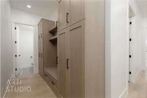Mudroom with light wood-type flooring, recessed lighting, and baseboards
