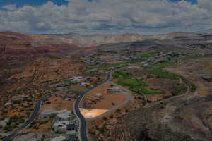 Aerial view of property's location featuring a mountainous background