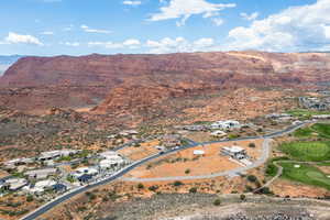Aerial view of property's location with a mountainous background