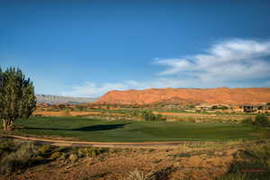 View of mountain background featuring a local golf course and a nearby body of water