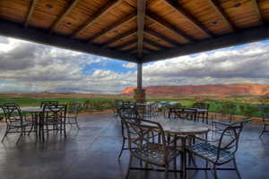 View of patio featuring a mountain view and outdoor dining area