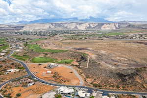 Aerial overview of property's location featuring a mountainous background