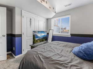 Carpeted bedroom with baseboards