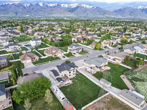 Aerial perspective of suburban area featuring a mountain backdrop