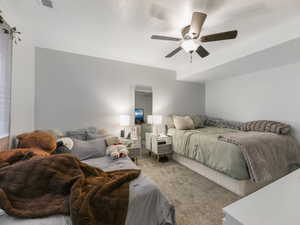 Bedroom featuring carpet flooring and ceiling fan