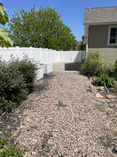 View of yard featuring fence