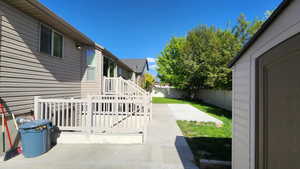 Fenced backyard with a patio area