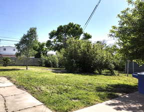 View of yard featuring fence