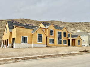 Property in mid-construction featuring a mountain view