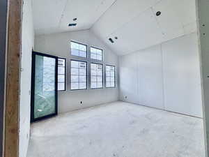 Unfurnished room with a high ceiling