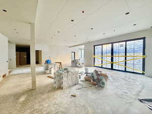 Misc room featuring unfinished concrete floors