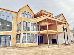 Back of house with a patio area