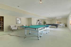 Game room featuring billiards and concrete floors