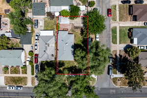 Aerial perspective of suburban area featuring property boundaries highlighted