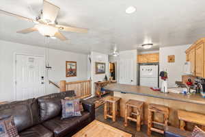 Living room featuring a ceiling fan