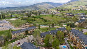 Aerial view featuring a mountain view and a peek of the pool