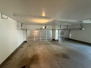 Garage featuring baseboards