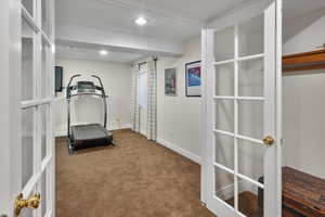 Exercise room featuring carpet floors, french doors, baseboards, and recessed lighting