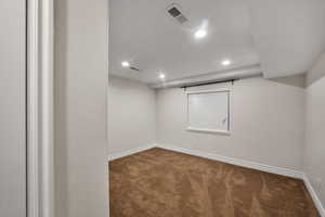 Unfurnished room featuring carpet floors, baseboards, and recessed lighting