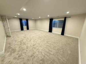 Spare room featuring recessed lighting and light colored carpet