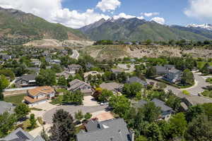 Aerial view of residential area featuring a mountainous background