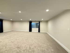 Unfurnished room featuring recessed lighting and light colored carpet