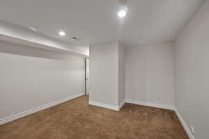 Below grade area featuring carpet flooring, baseboards, and recessed lighting