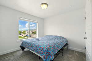 Bedroom with carpet flooring and baseboards