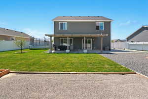 Back of property with a trampoline, a patio, and central air condition unit