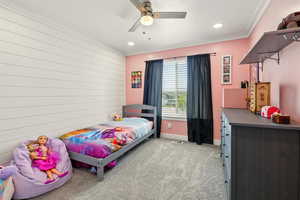 Bedroom with light carpet, crown molding, baseboards, recessed lighting, and a ceiling fan