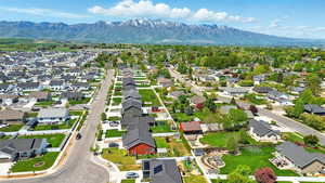 Aerial view of residential area featuring a mountainous background