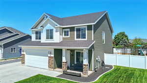 Craftsman house featuring stone siding, driveway, roof with shingles, and covered porch