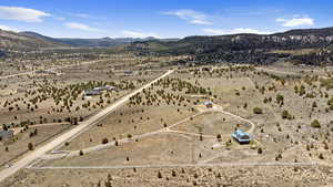 Aerial view of sparsely populated area featuring a desert landscape and mountains