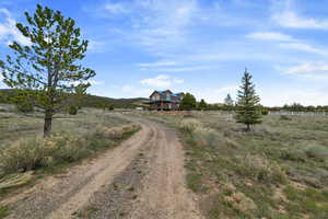 View of dirt / gravel road featuring a view of countryside