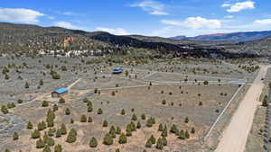View of rural area featuring a desert landscape and a mountain backdrop