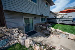 Back of house with a wooden deck