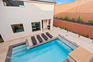 View of pool featuring a fenced backyard and a patio area