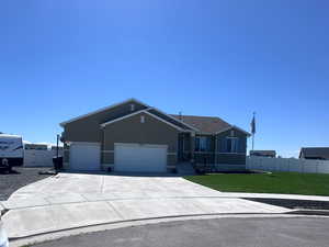 View of front of home featuring driveway and a garage