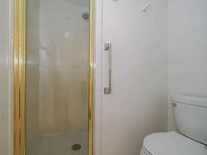Primary Bathroom with toilet and shower & sink.