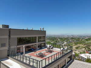 Balcony with a mountain view and outdoor dining space