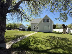 Rear view of property featuring a garage